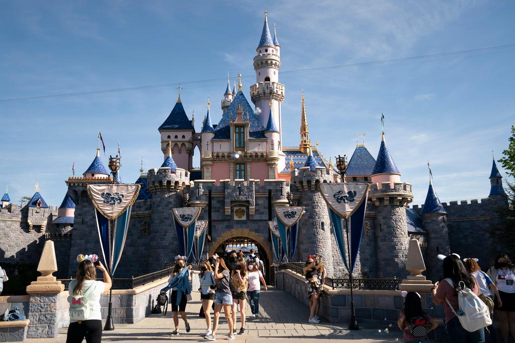 Visitors pass through Disneyland in Anaheim, Calif., April 30, 2021.