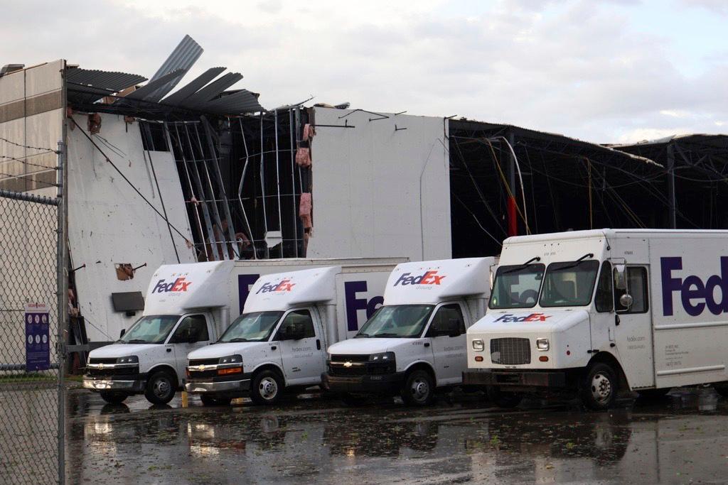 FedEx trucks sit outside a damaged FedEx facility after a tornado in Portage, Mich., Tuesday, May 7, 2024. 