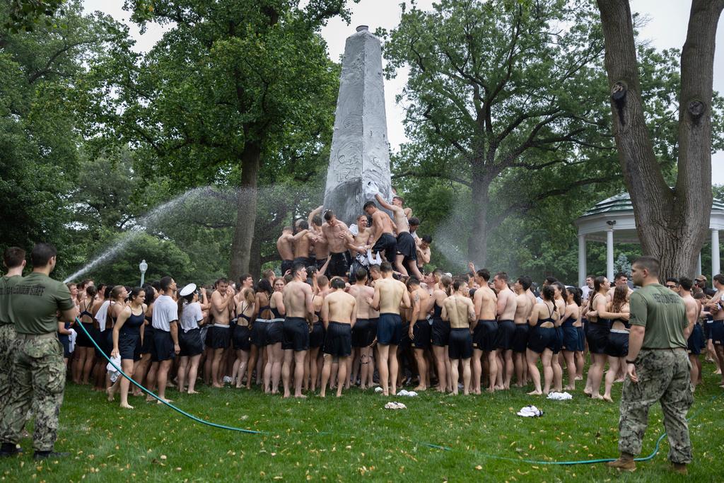 Class of 2027 plebes climb during the Herndon Monument Climb at the U.S. Naval Academy in Annapolis, Md. 
