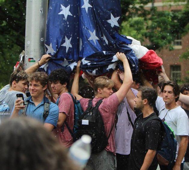 UNC frat students re-raise and then protect American flag from protestors