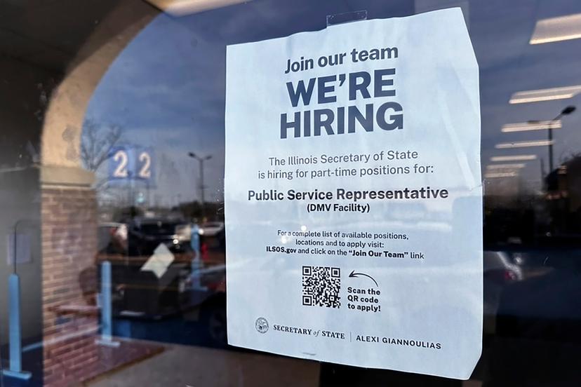 A hiring sign is displayed at the Department of Motor Vehicles office in Deerfield, Illinois