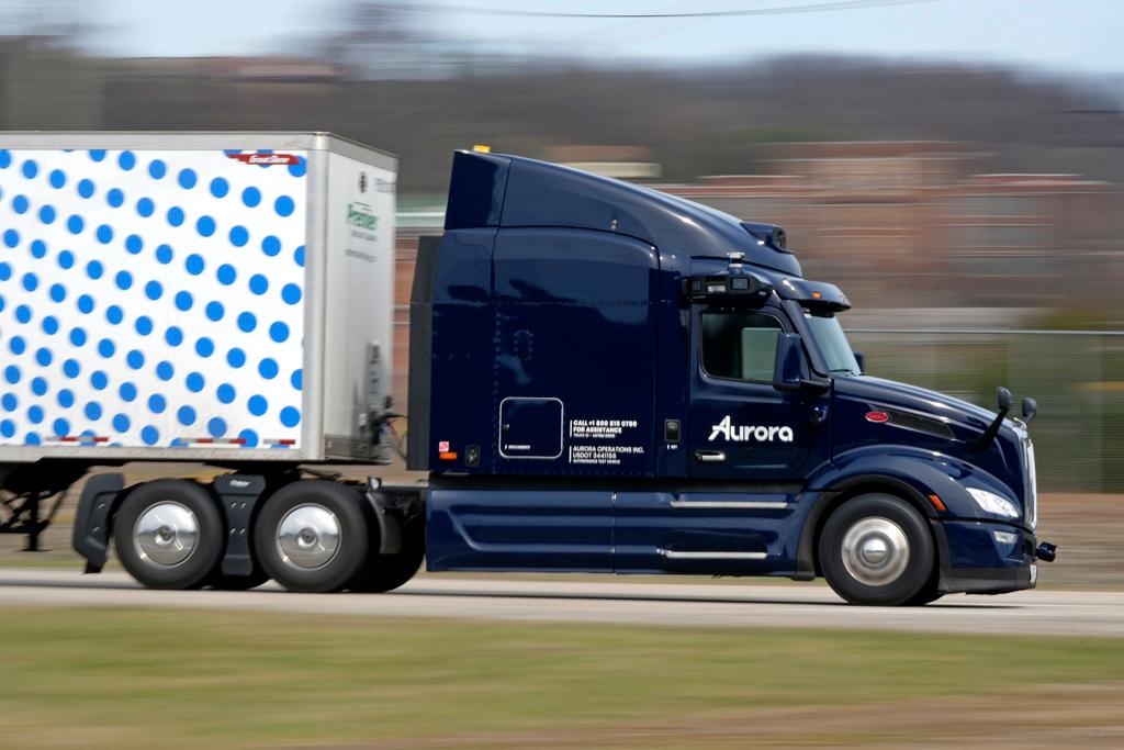 A self-driving tractor trailer maneuvers around a test track in Pittsburgh