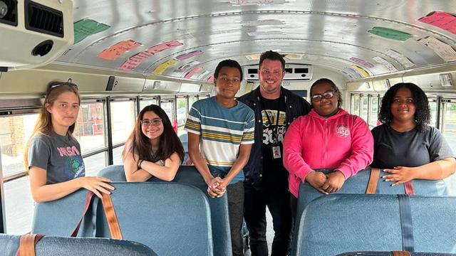 Anthony Burgess, a bus driver for Pinellas County Schools in Florida, spreads positivity to students with handwritten messages displayed on the inside of his school bus.