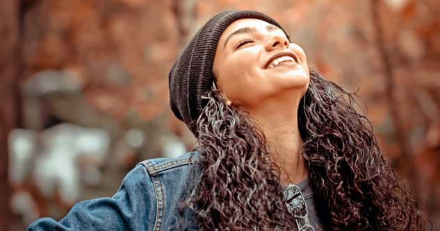 happy girl smiles to sky