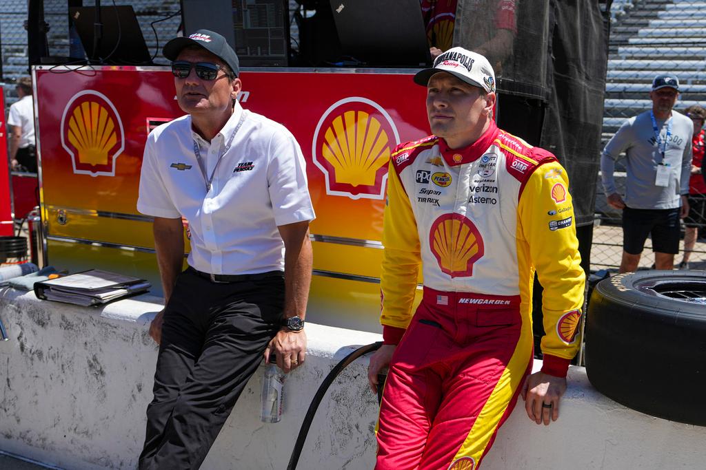 Now former-President of Team Penske Tim Cindric, left and driver Josef Newgarden wait for the start of during practice for the Indianapolis 500 auto race at Indianapolis Motor Speedway in Indianapolis, Sunday, May 18