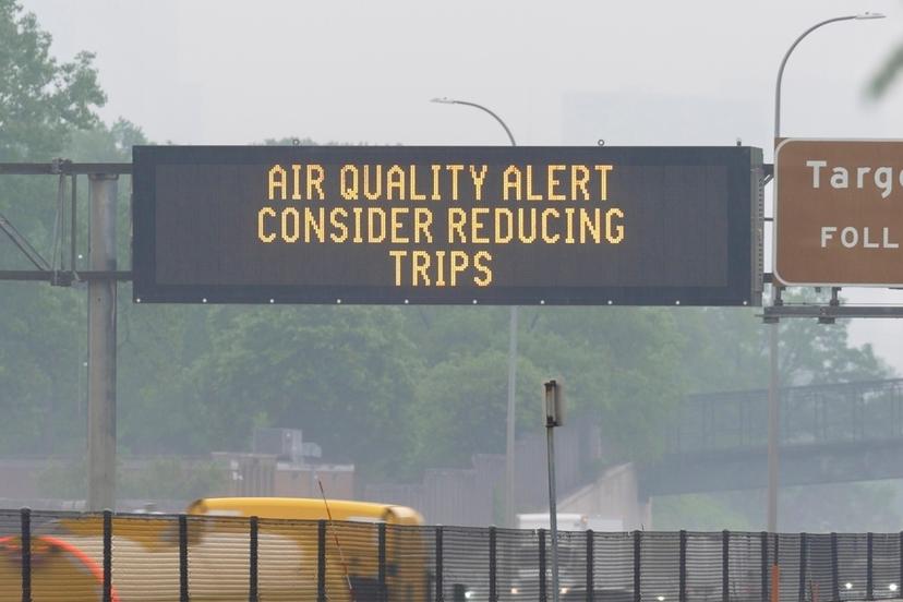 Sign warns of an air quality alert as smoke from wildfires burning in Canada reaches Minneapolis