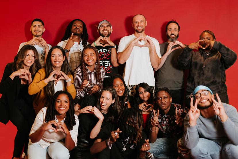We Love Philly Team holding up hand signals showing, hearts, love, and peace. 