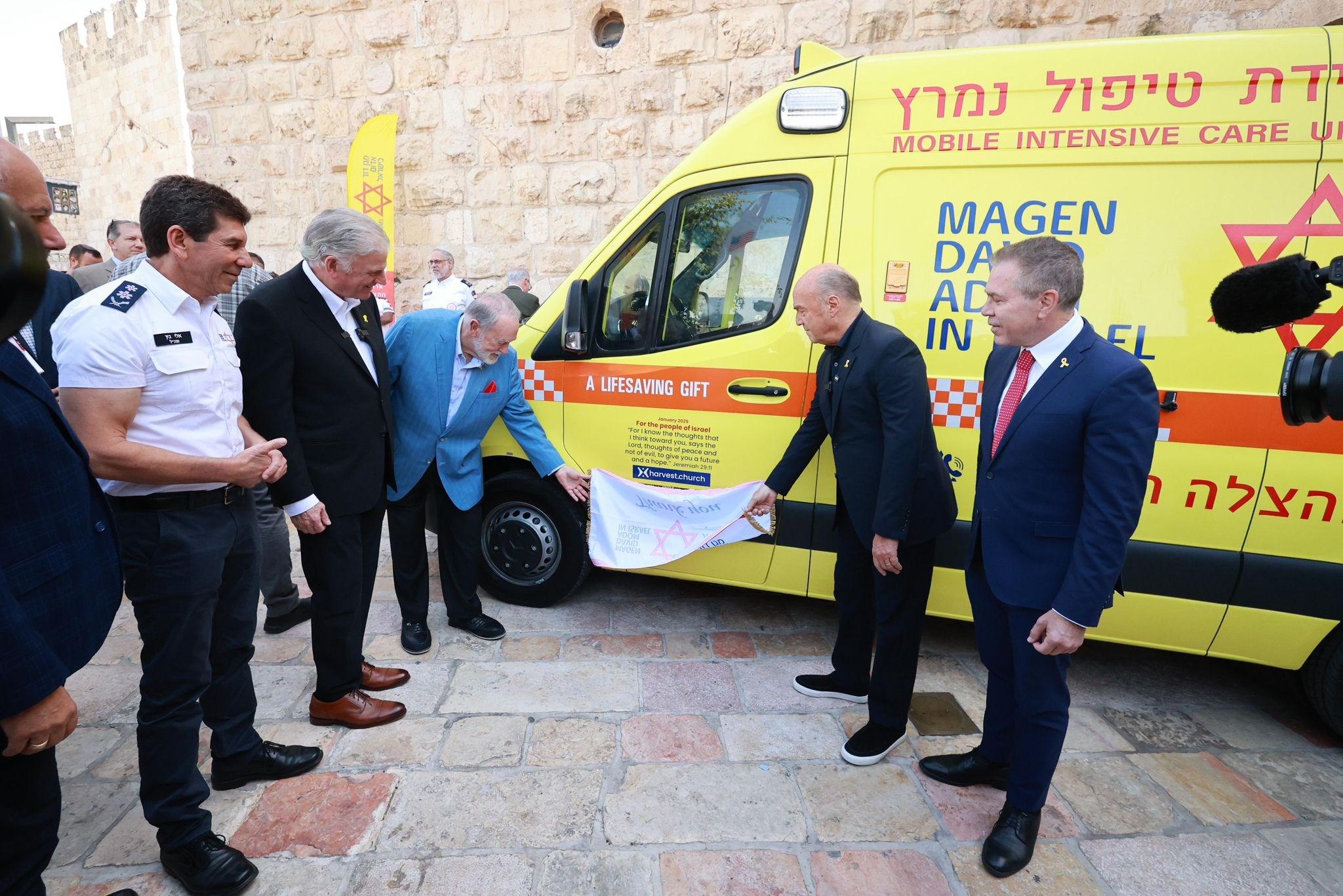 Franklin Graham, Pastor Greg Laurie, Ambassador Mike Huckabee dedicate and bless ambulance