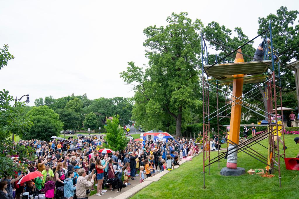 Hundreds of people gather to watch the 3rd Annual Sharpening of the Lake of the Isles Pencil in Minneapolis 