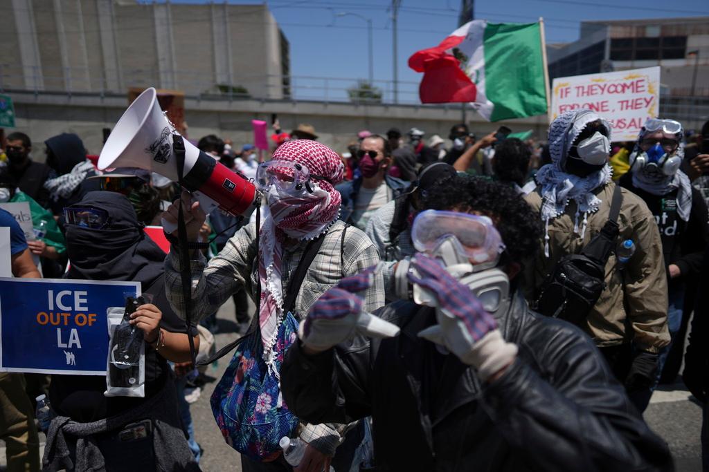 Protesters confront a line of U.S. National Guard in the metropolitan detention center of downtown Los Angeles