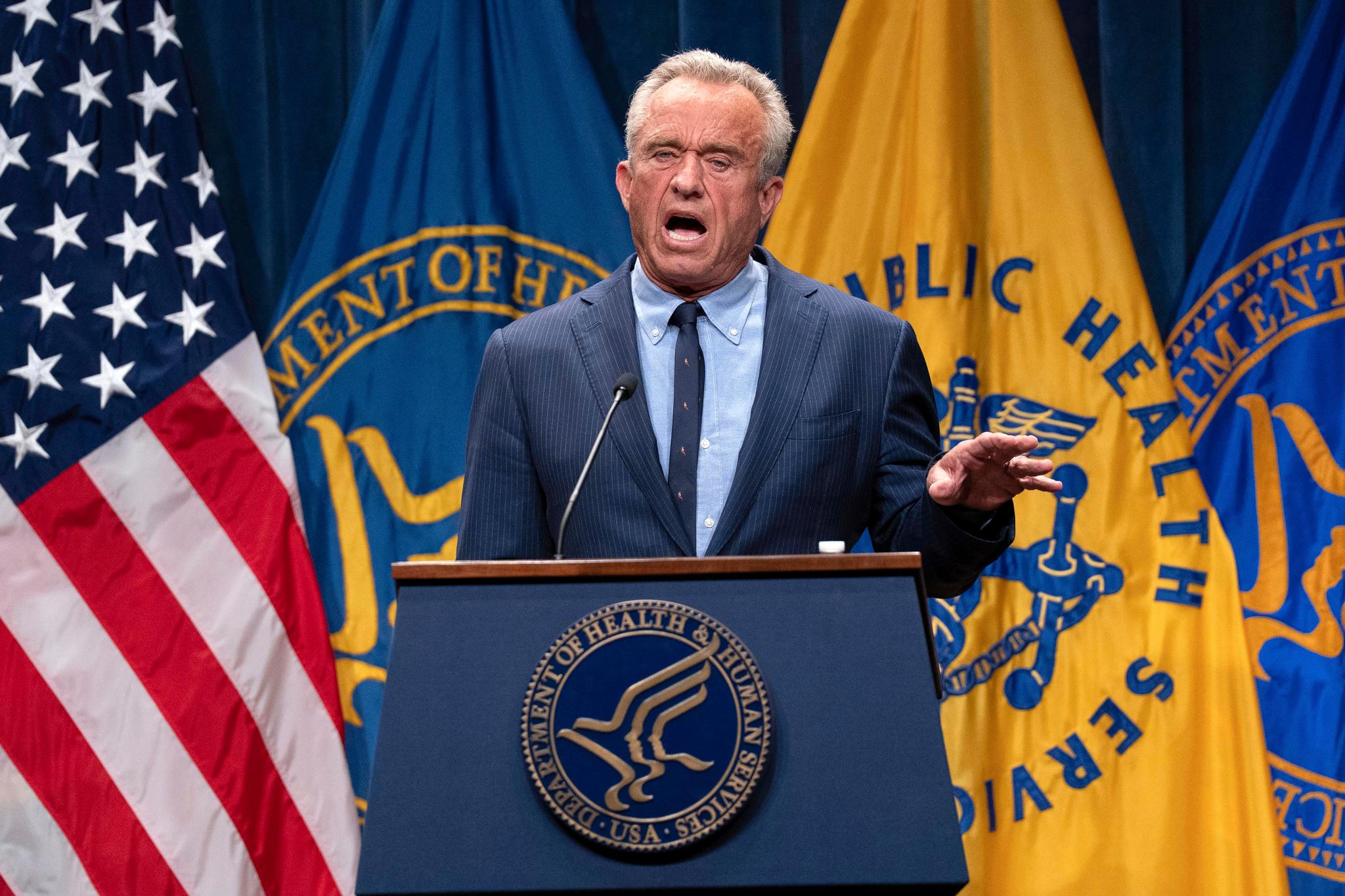 Man speaking in front of microphone