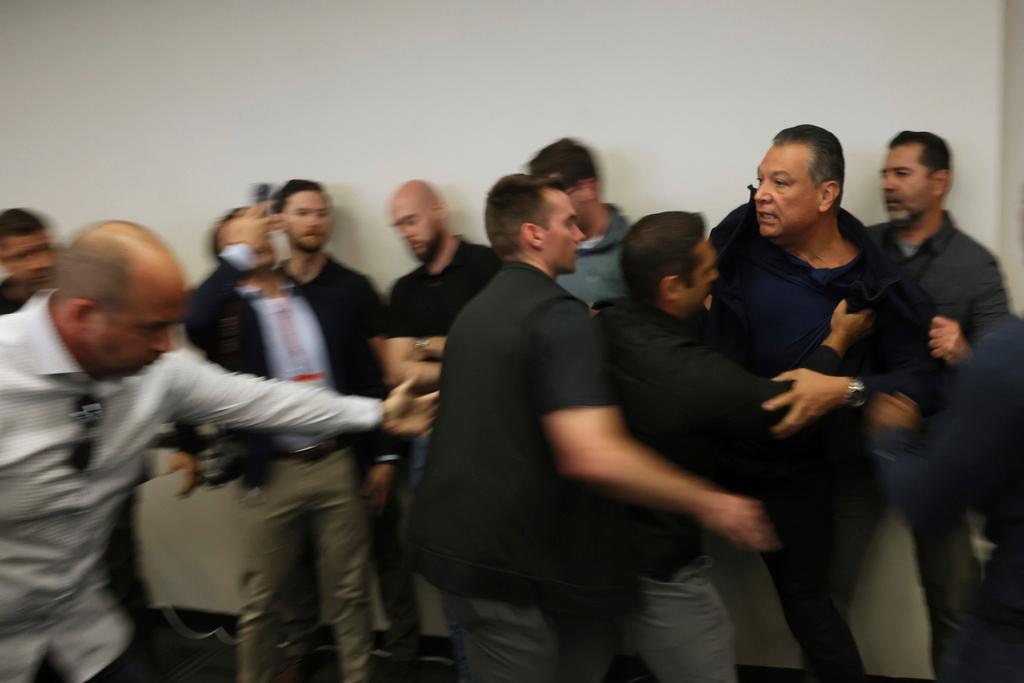 U.S. Sen. Alex Padilla, D-Calif., is pushed out of the room as Homeland Security Secretary Kristi Noem holds a news conference regarding the recent protests in Los Angeles 