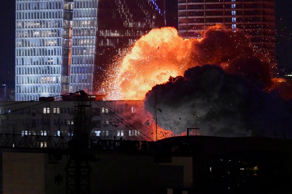 An explosion is seen during a missile attack in Tel Aviv, Israel