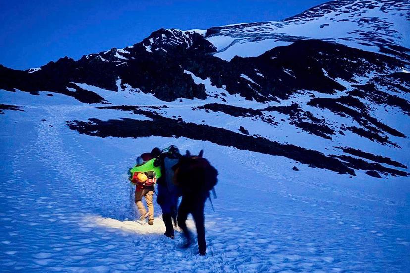 Alpine Rescue Team members take part in helping get two men struck by lightning off Torreys Peak in Colorado