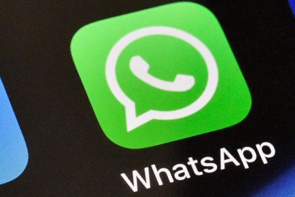 WhatsApp icon is displayed on an iPhone