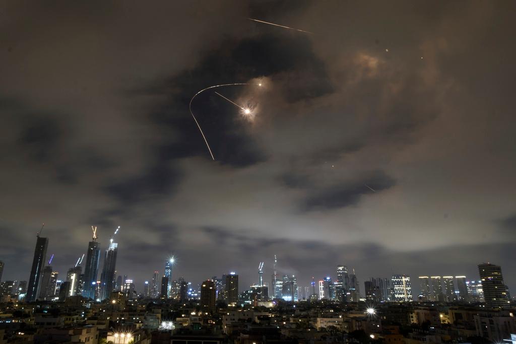 Israeli air defense system fires to intercept missiles during an Iranian attack over Tel Aviv
