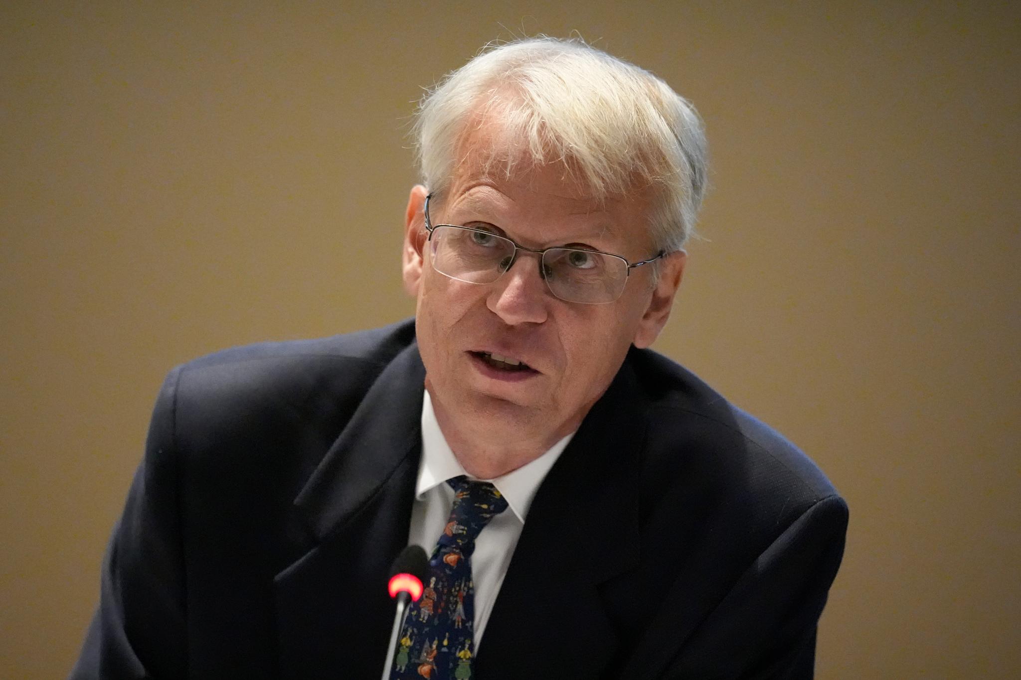 Man speaking in front of microphone