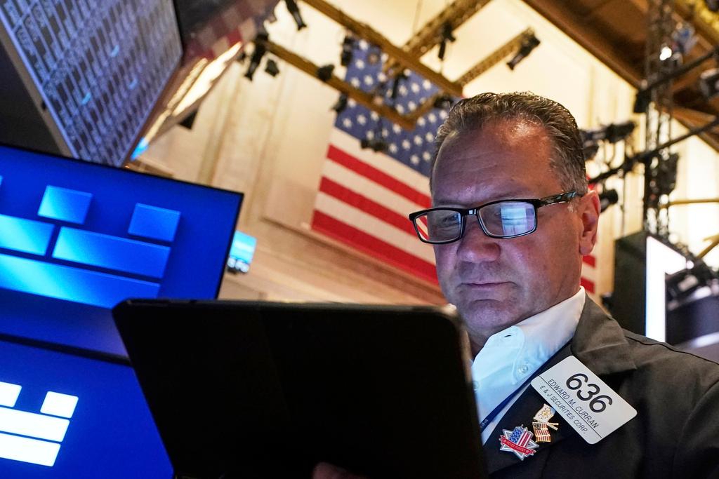 Trader Edward Curran works on the floor of the New York Stock Exchange