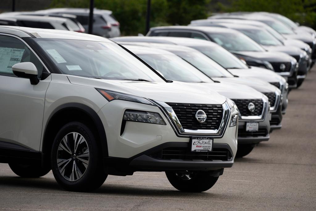 Unsold 2021 Rogue sports-utility vehicles sit on a lot at a Nissan dealership Colorado on June 27, 2021