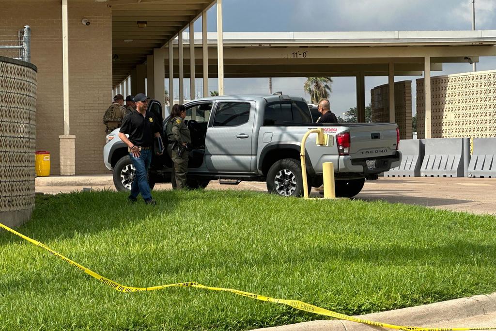 Officials work the scene of a shooting at a Border Patrol facility in McAllen, Texas