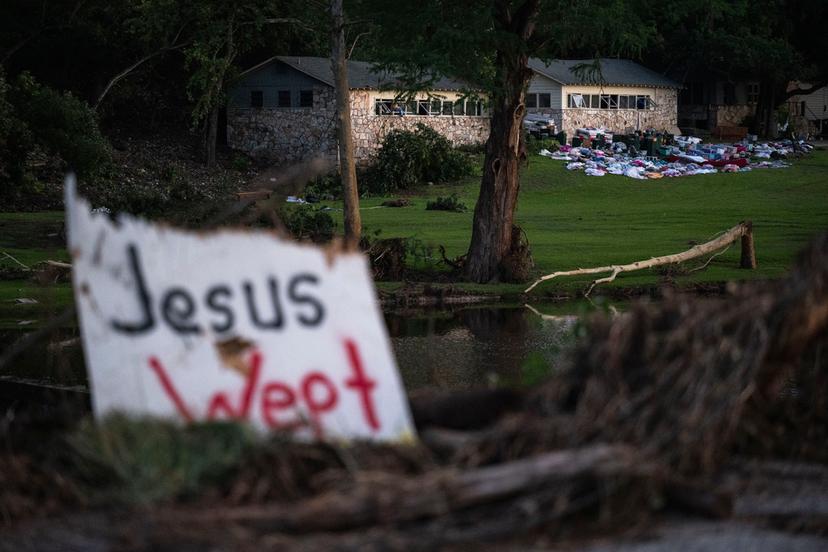 Campers belongings sit outside one of Camp Mystic's cabins near the Guadalupe River