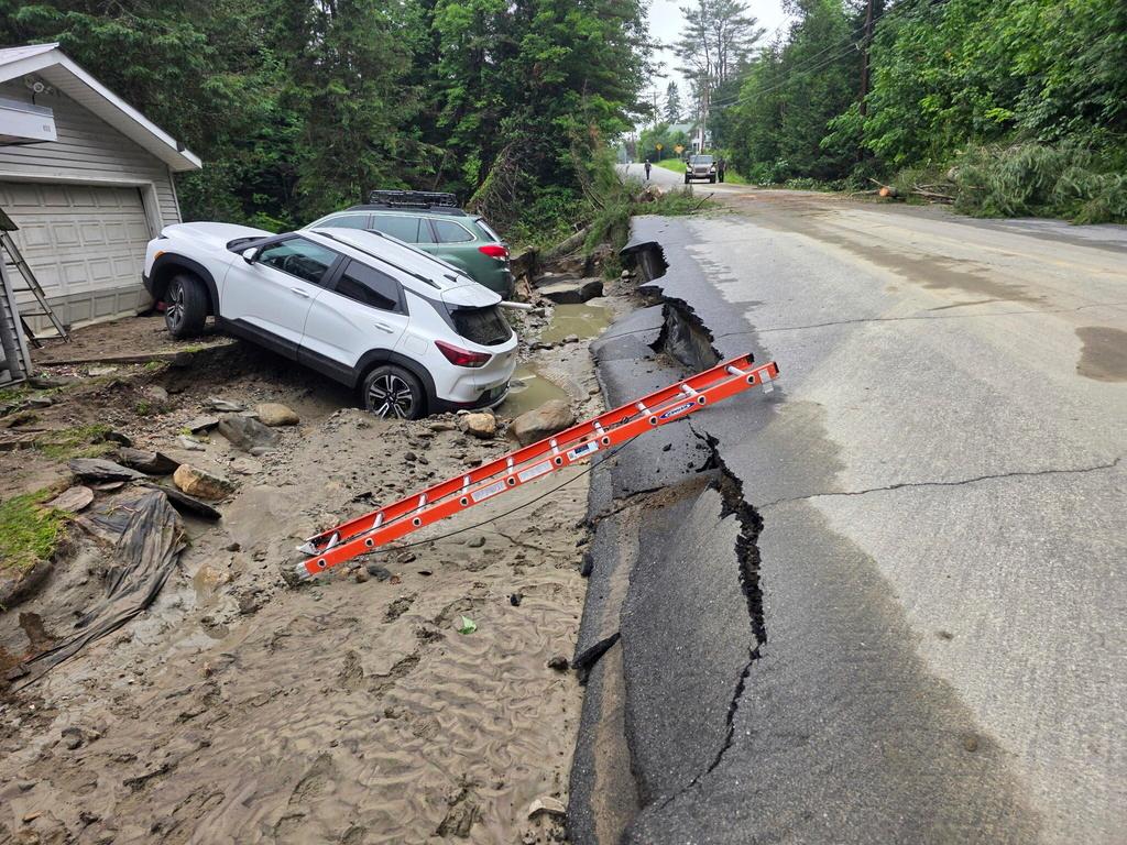 Roads and homes damaged due to flash flooding caused by heavy rains in Sutton, Vt.