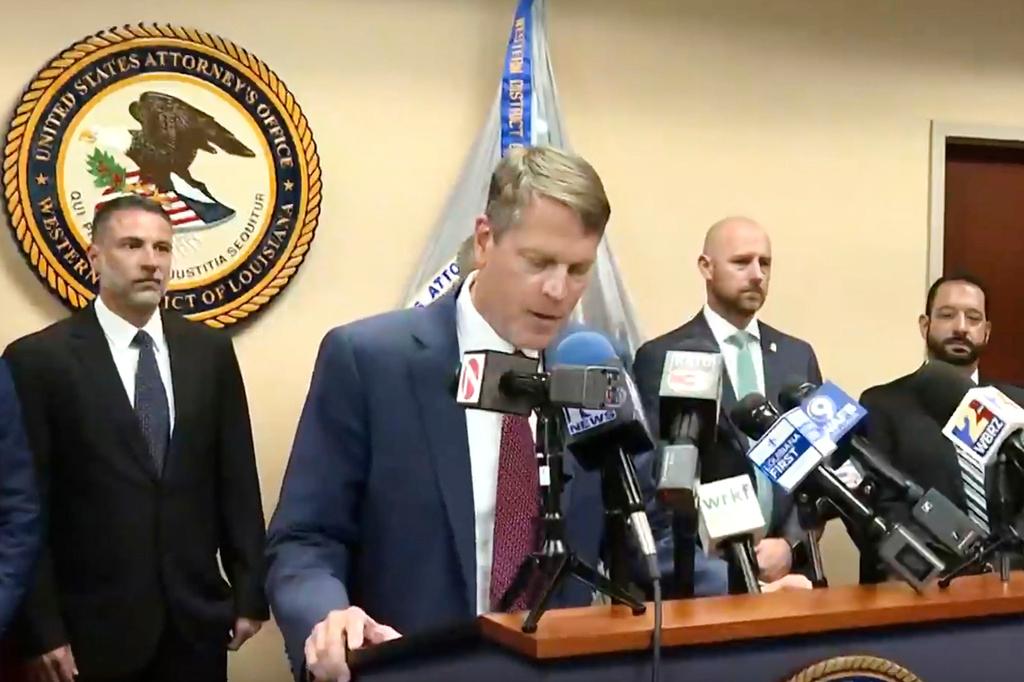 U.S. Attorney Alexander C. Van Hook announcing charges against current and former police officers 