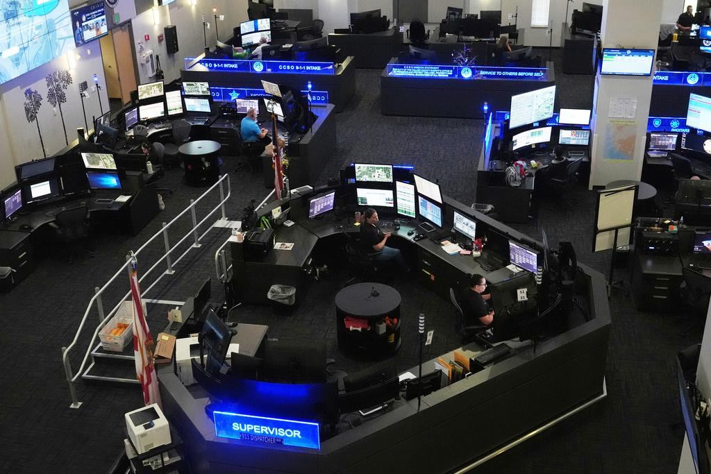 Dispatchers work emergency calls at the Collier County Emergency Services Center