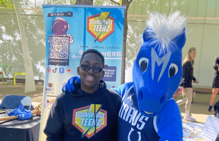 Young teen with blue Mavs mascot