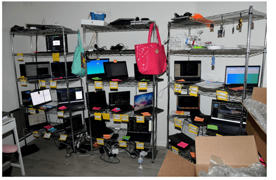 Christina Chapman organized and stored U.S. company laptops in her home, and included notes identifying the U.S. company and identity associated with each laptop.