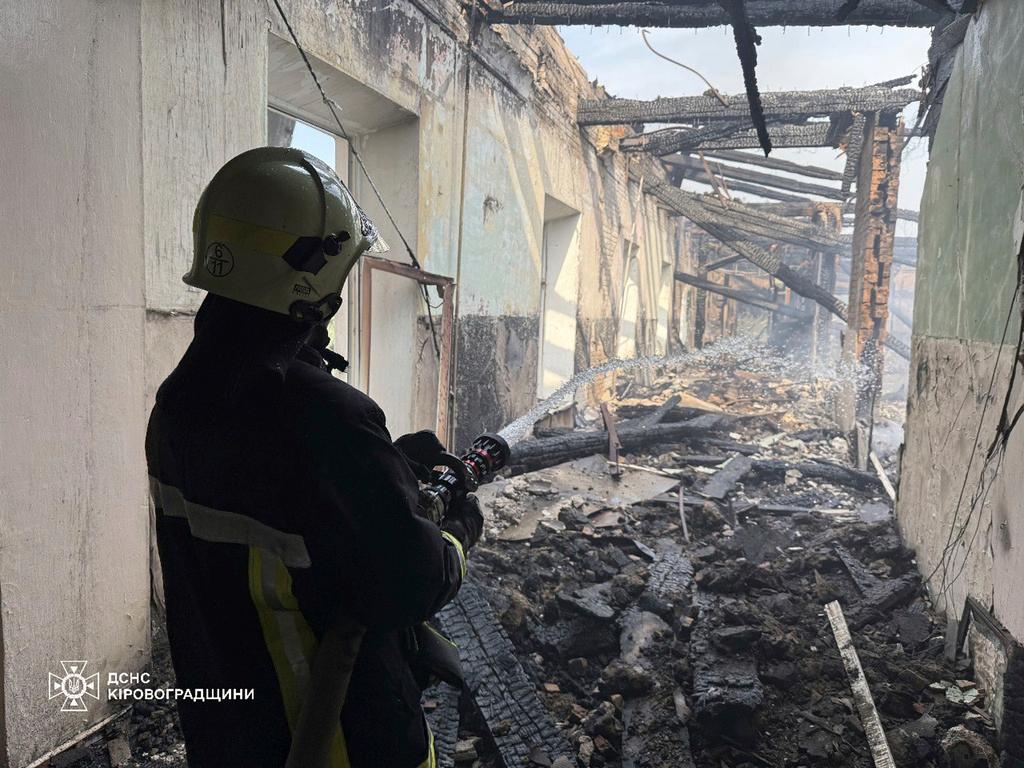 Firefighters put out the fire in a school following a Russian air attack in Kropyvnytskyi, Ukraine