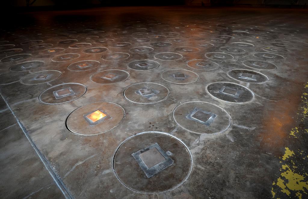 Radioactive waste sealed in large stainless steel canisters is stored under five feet of concrete in a storage building at the Savannah River Site, near Aiken, S.C.