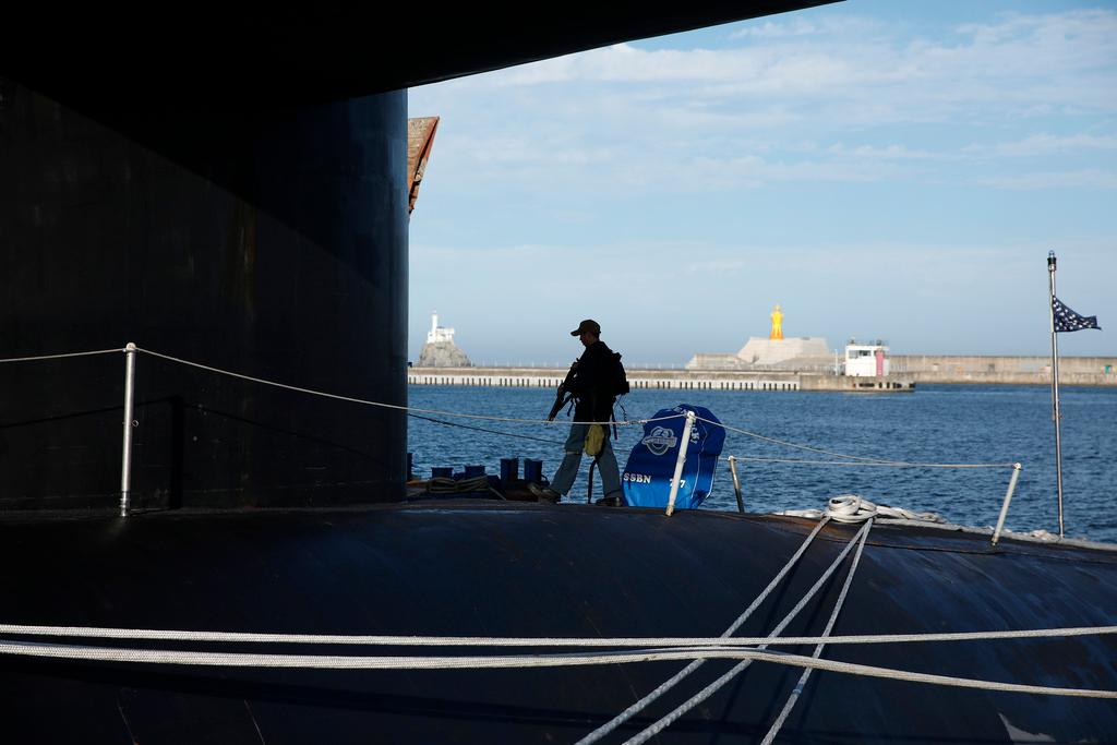 A crew patrols on the deck of the USS Kentucky, a U.S. nuclear-armed submarine