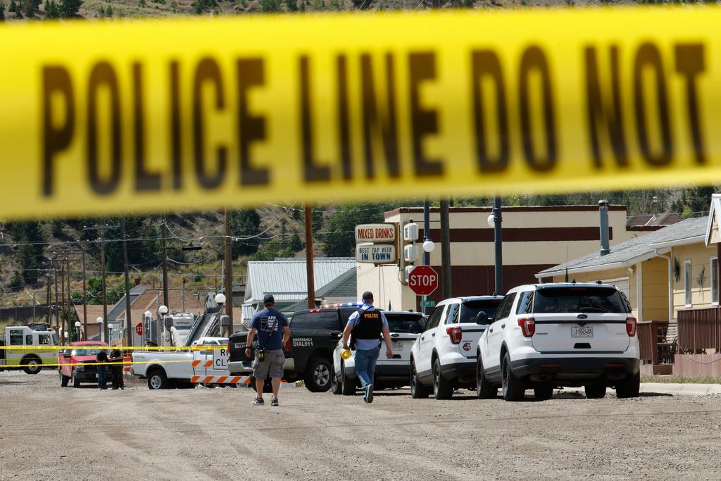 Police and other emergency personnel are seen after a reported shooting in Anaconda, Mont.