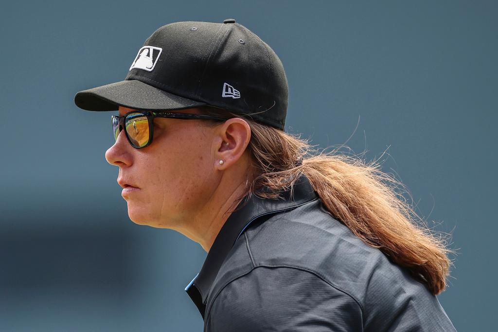 Umpire Jen Pawol, looks on during the first inning of a baseball game of a doubleheader between the Atlanta Braves and Miami Marlins