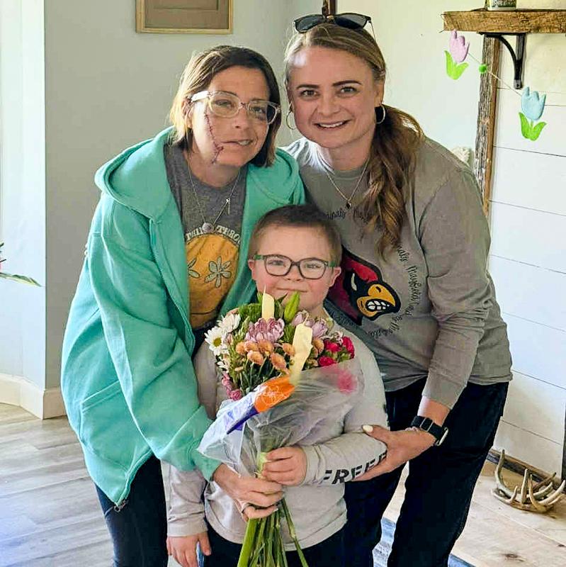 Teacher Lindsey Crouch (left) is given a bouquet by one of her students