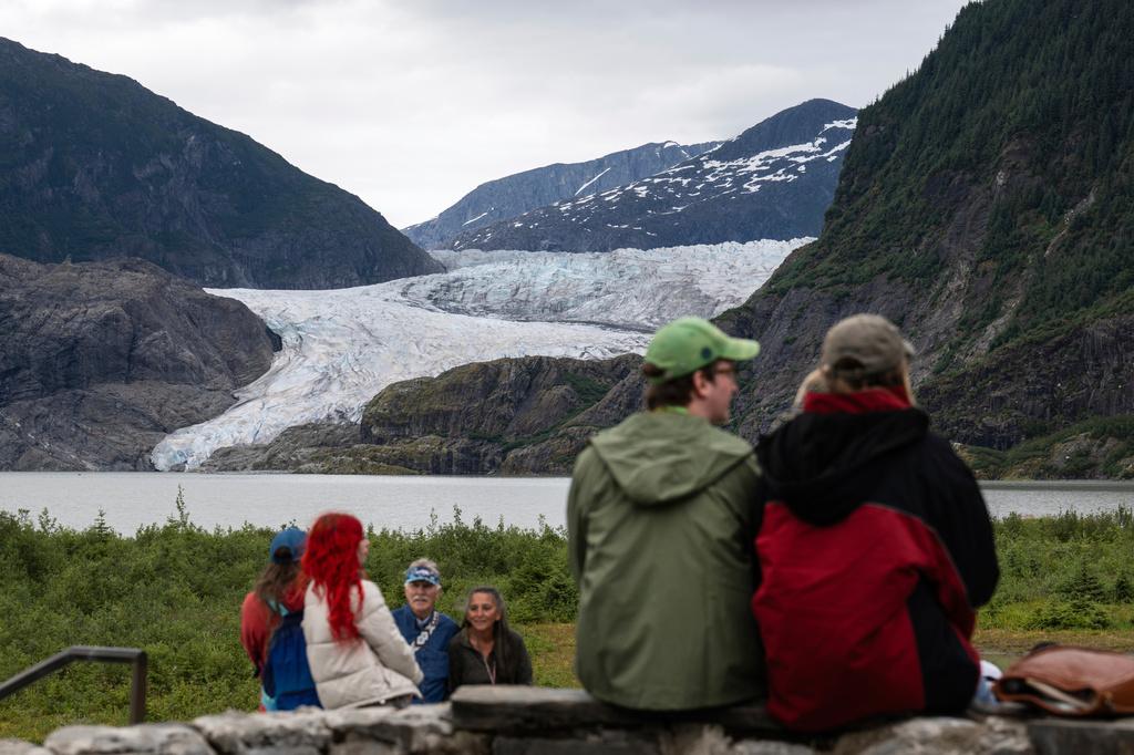 People view Mendenhall Glacier from the Mendenhall Glacier Visitors Center area in Juneau, Alaska