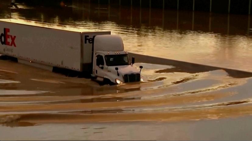 Truck drives through flooded road in Chattanooga, Tenn.