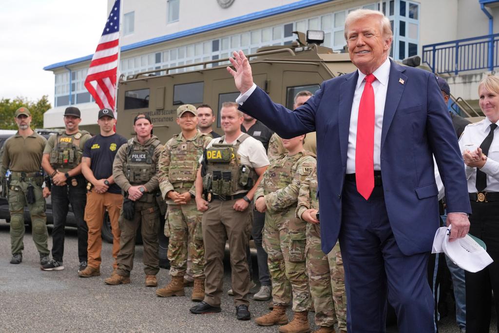President Donald Trump speaks with members of law enforcement and National Guard soldiers in Washington