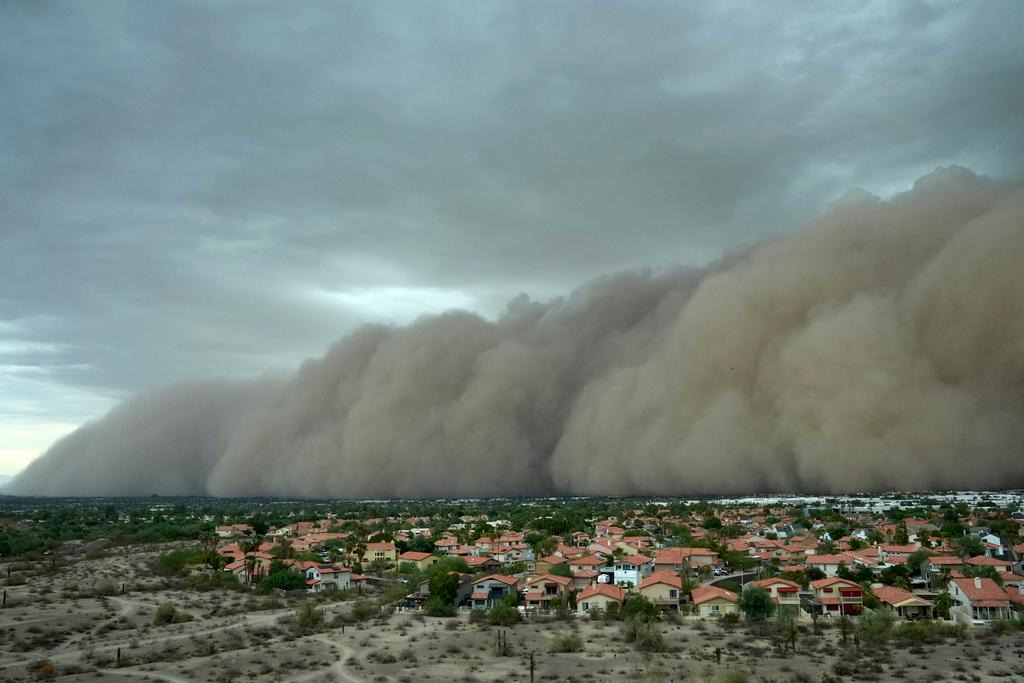 Giant dust storm approaches the Phoenix metro area as a monsoon storm pushes the dust into the air
