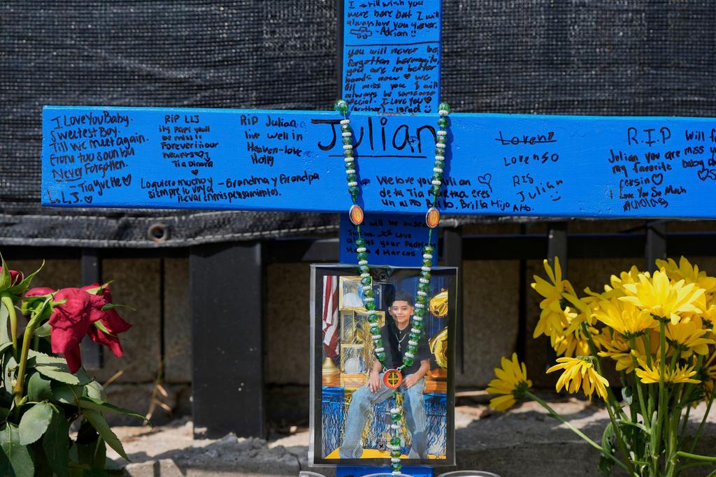A makeshift memorial for 11-year-old Julian Guzman, who was shot and killed during a doorbell prank