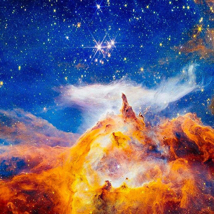This cloud — the so-called Lobster Nebula — is so massive that it spills beyond the camera lens.