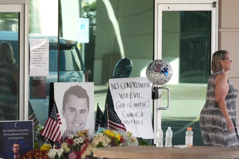 Well-wishers pay their respects at a makeshift memorial at the national headquarters of Turning Point USA 