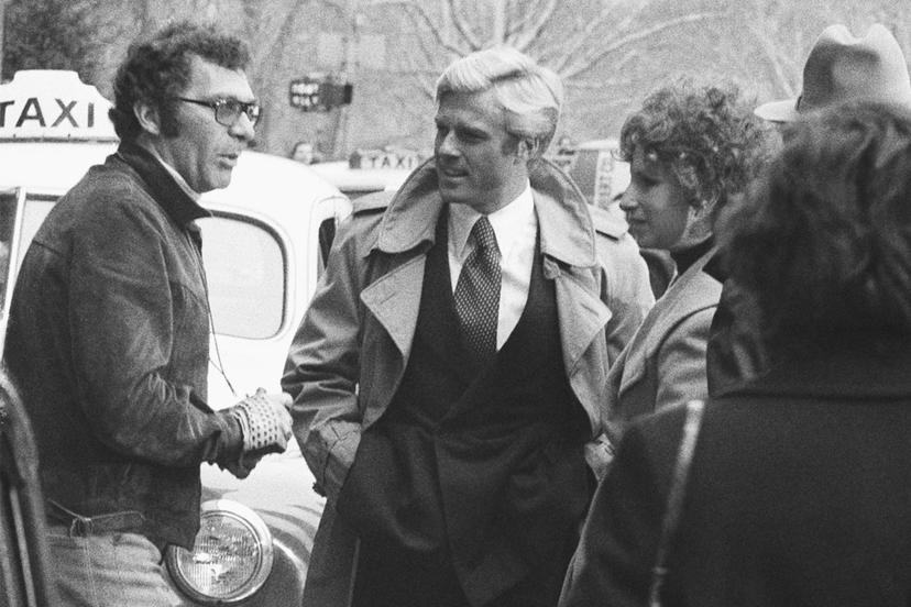 Director Sydney Pollack, left, appears with actors Robert Redford, center, and Barbra Streisand during the filming of "The Way We Were" in New York 