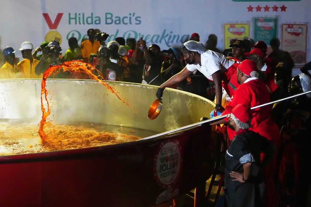 Chef Hilda Baci attempts to cook the world's largest pot of Jollof Rice 