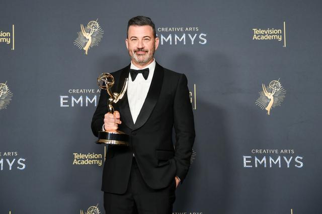 Man holding an Emmy