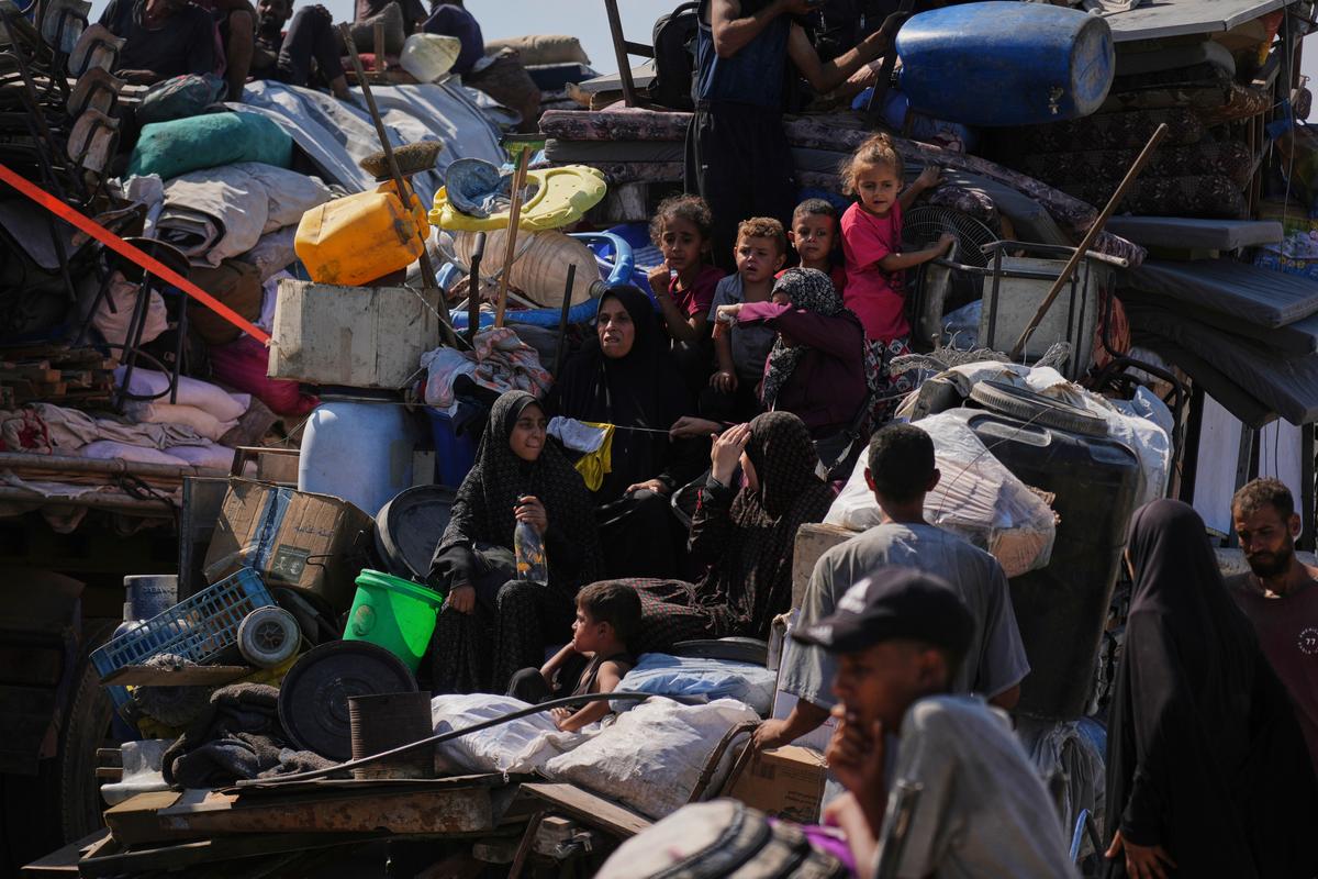 Gaza people surrounded by water jugs