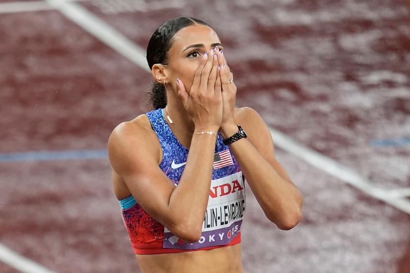 Sydney McLaughlin-Levrone, reacts after winning in the women's 400 meters final at the World Athletics Championships in Tokyo