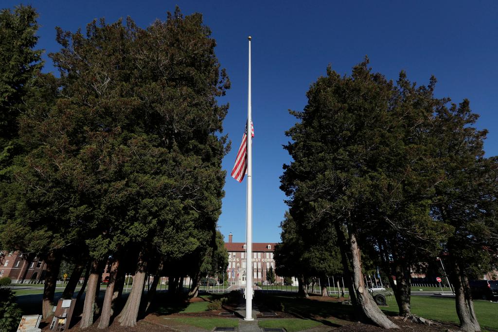 The main flag pole in front of the U.S. Army I Corps headquarters on Joint Base Lewis-McChord, south of Tacoma, Wash., hangs at half-staff