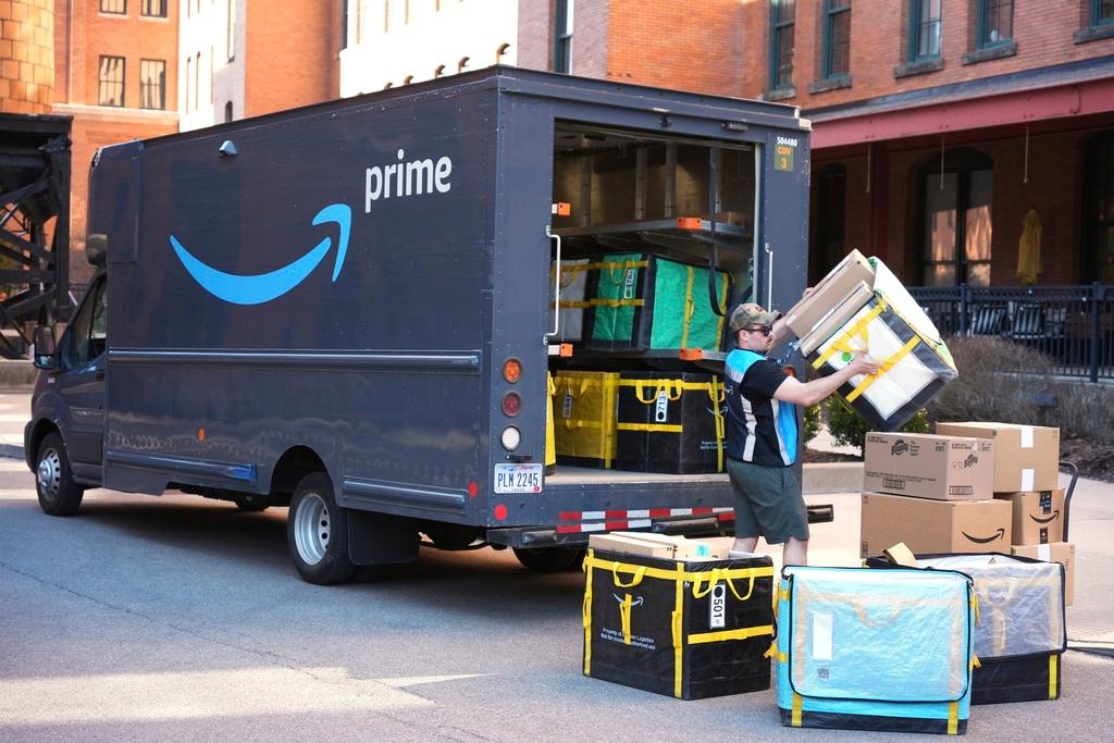 Amazon Prime driver makes a delivery outside an apartment building in Pittsburgh